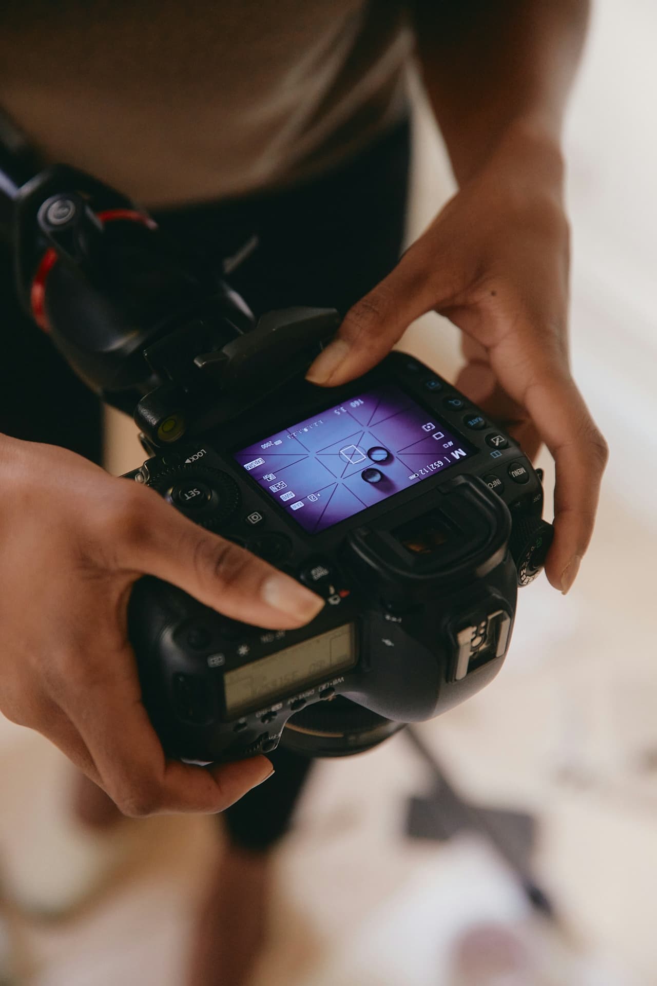 Photographer reviewing shots between takes